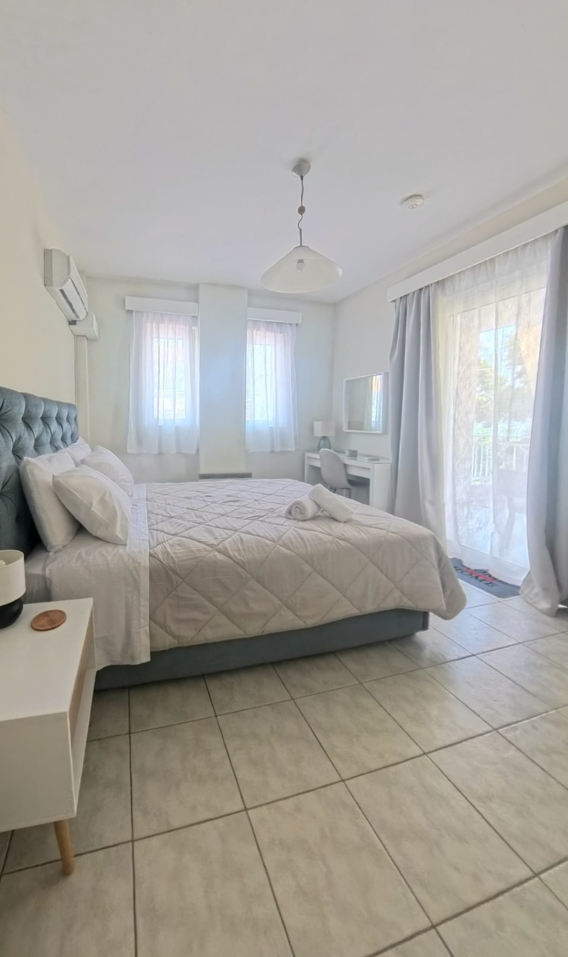 Twin bedroom — bed and balcony access