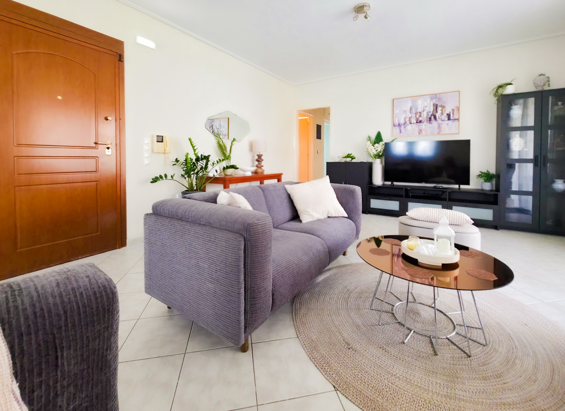 Living room with sofa, coffee table and TV