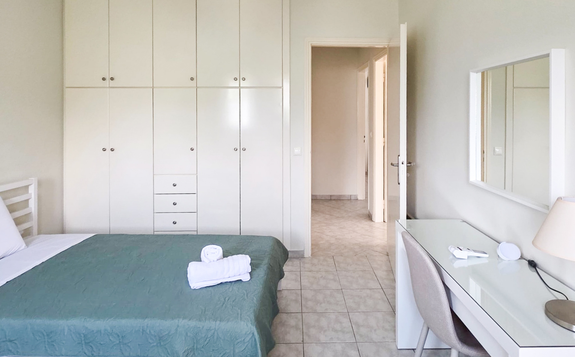 Third bedroom with wardrobe storage and desk