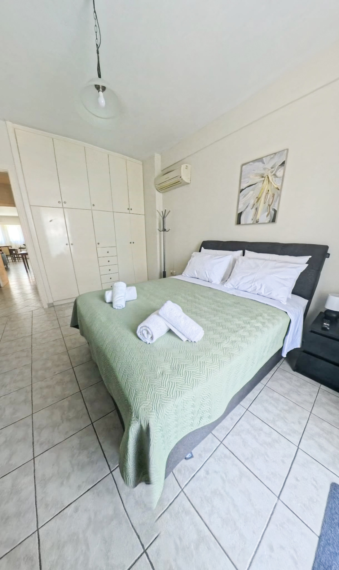 Master bedroom with wardrobe and air conditioning