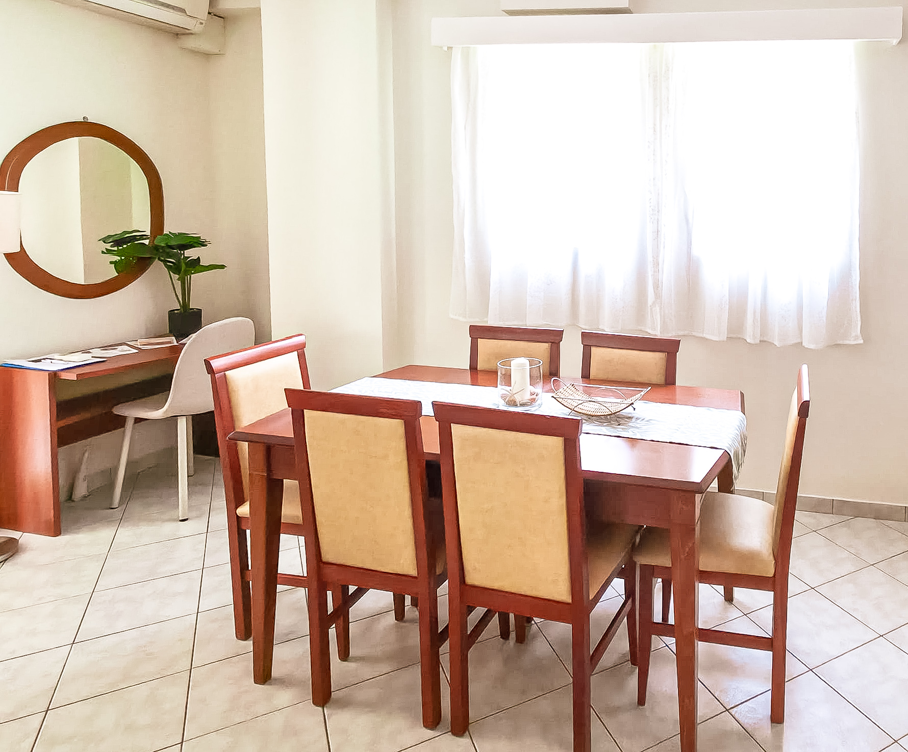Dining table with six chairs and natural light