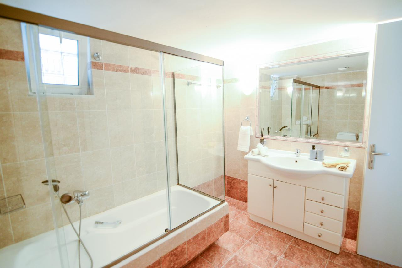 Main bathroom — shower and vanity