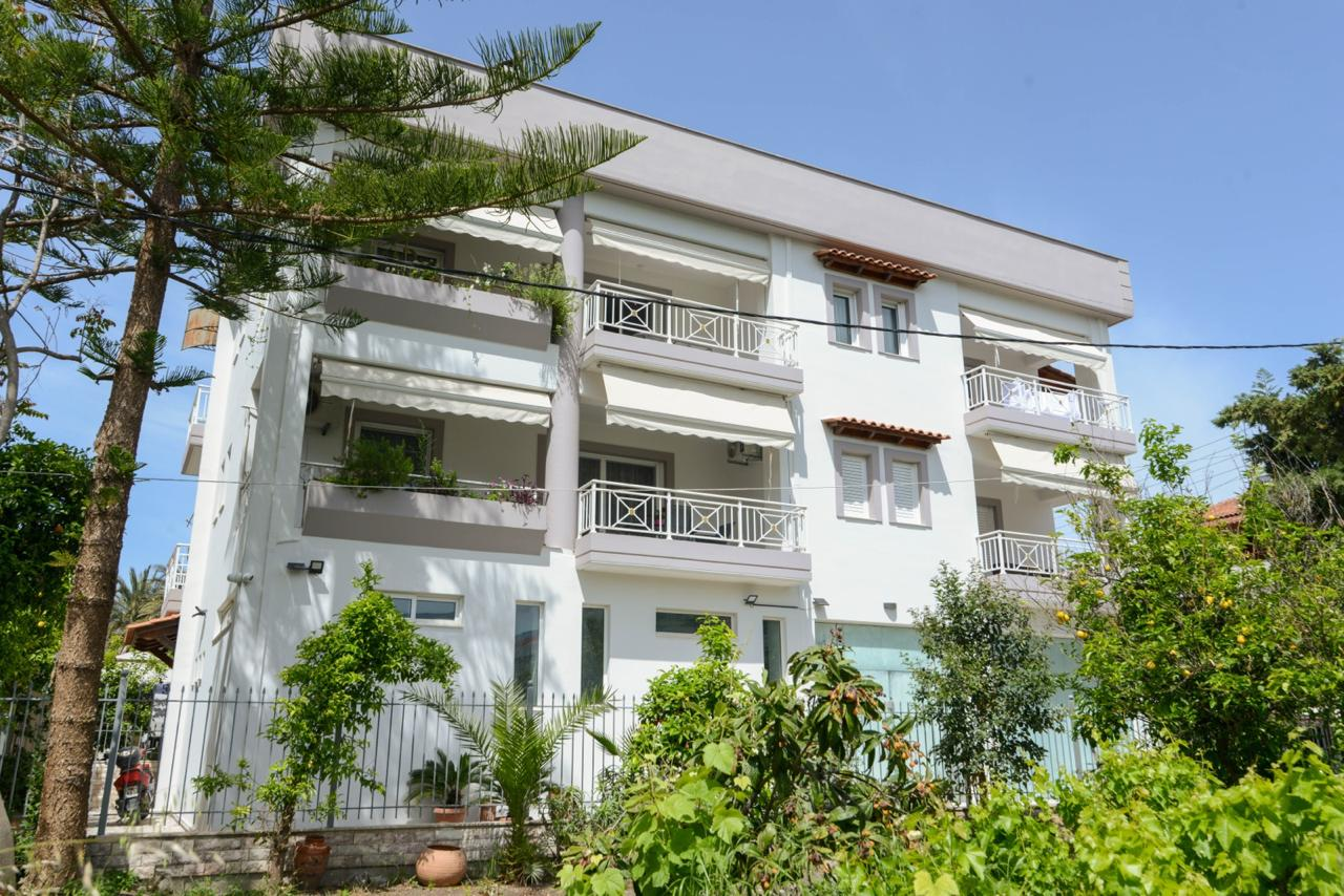 Building exterior with balconies and garden